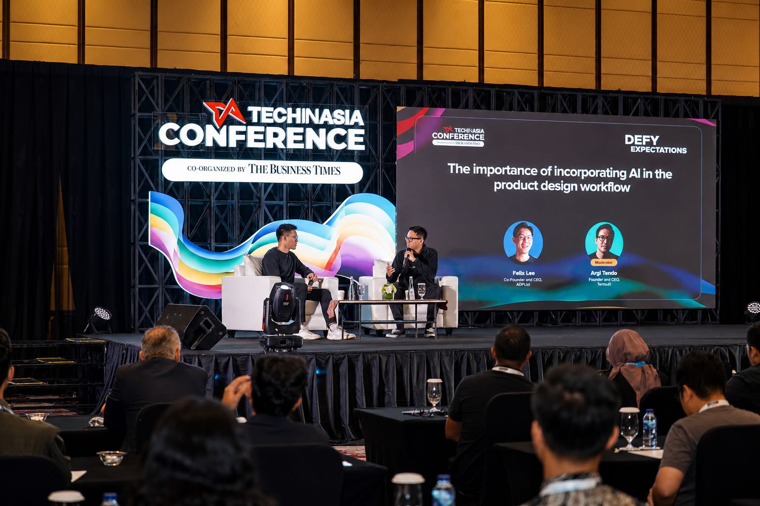 Argi Tendo moderating on stage at Tech in Asia Conference
