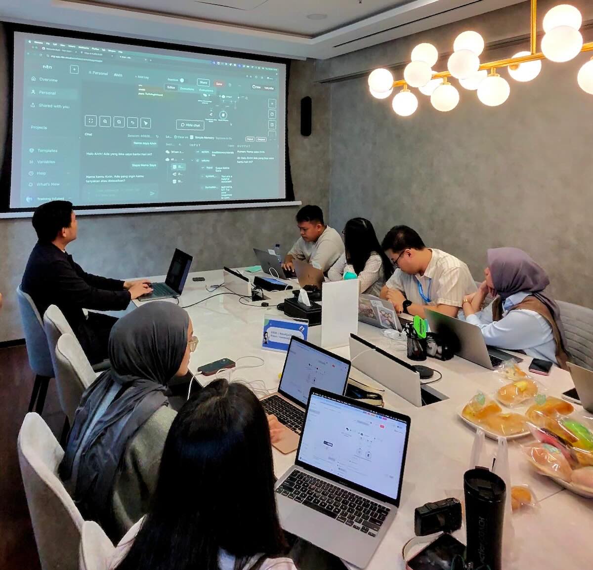 Argi Tendo training participants at the Ajaib AI automation workshop with Infused and Latih AI