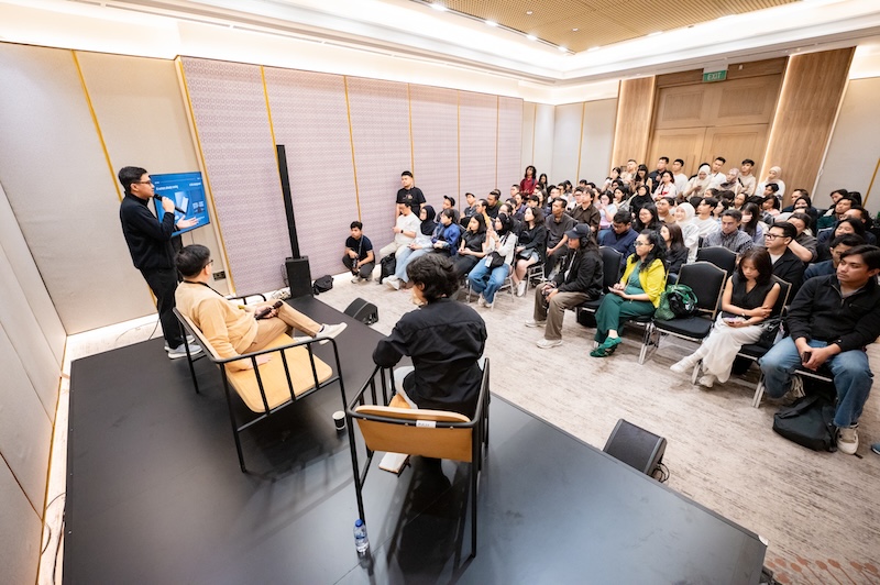 Argi Tendo speaking about AI agents at IdeaFest 2026